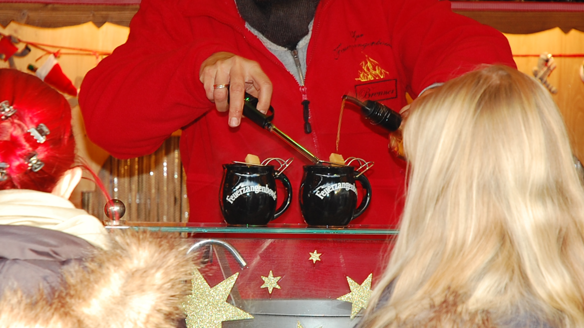 The Feuerzangerbowle lady gets ready to torch a booze=soaked sugar cube